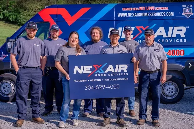 The NexAir Home Services team in front of a branded service van